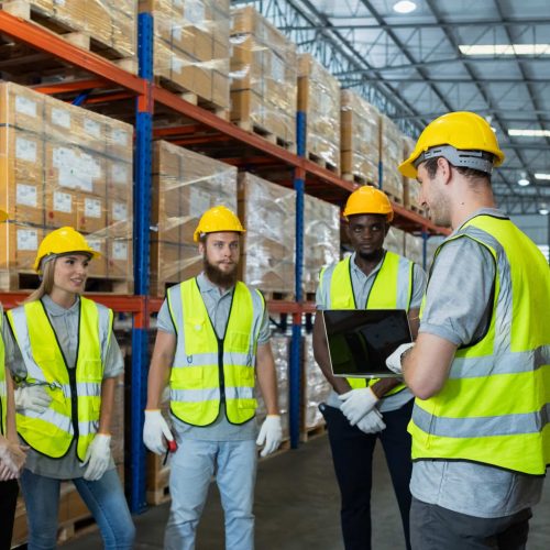 Full team engineering warehouse worker meeting brainstorm. Teamwork professional workshop in warehouse store. Logistics factory industry supervisor manufacture. business logistics and transport.